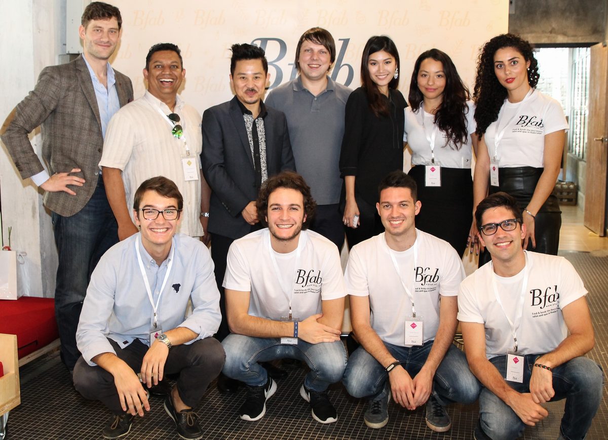 The Bfab team and partners together in front of a branded Bfab backdrop.