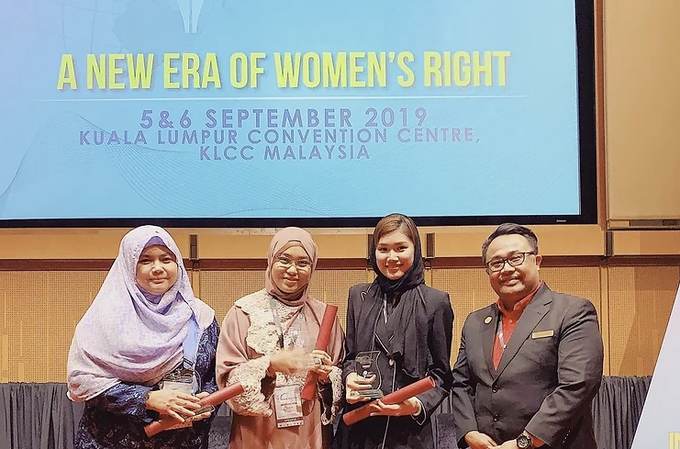 Award recipients on stage at A New Era of Women's Rights, Kuala Lumpur Convention Centre.