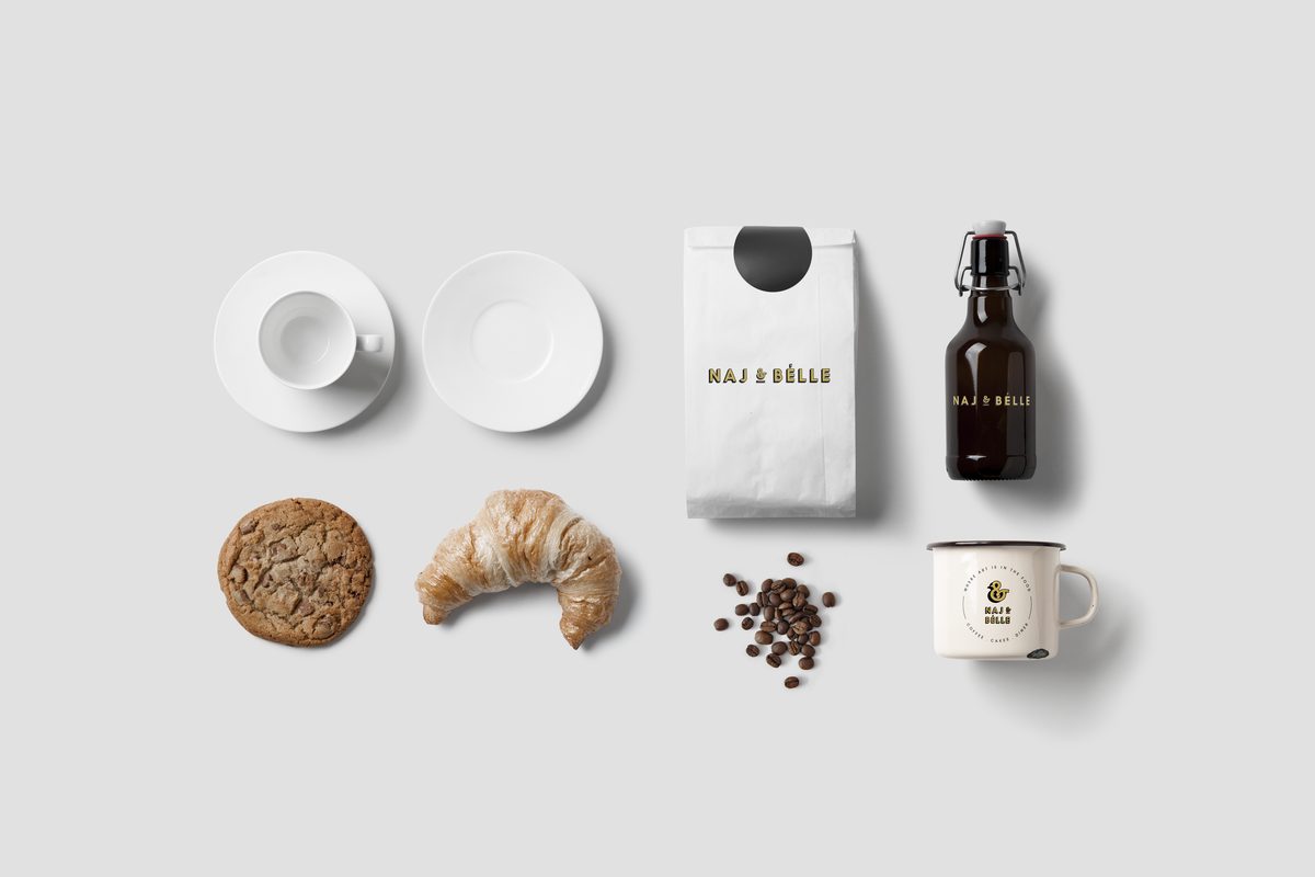 Naj and Belle brand identity applied across a coffee bag, bottle, enamel mug and tableware.